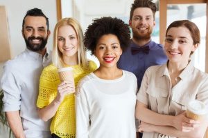 A group of business men and women in Virginia posing for a picture after a meeting about potential non-compete violations after their non-compete agreement was modified