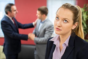 woman working for a business who does not abide by employment discrimination laws