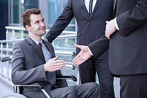 a man with a disability returning to work after being diagnosed with Parkinsons disease after speaking with an employment law attorney in case he faced disability discrimination