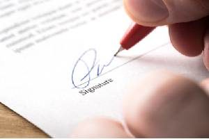 A person signing a settlement agreement for wrongful termination