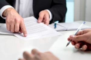 Employment law attorney guiding client through a settlement agreement for wrongful termination