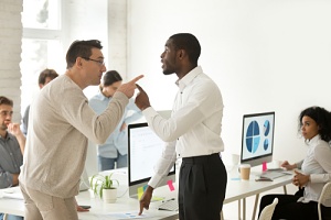 two men fighting over an employer discrimination problem