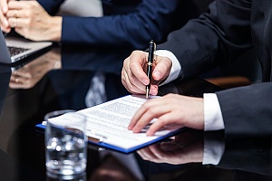 a person signing important cda or nda documents