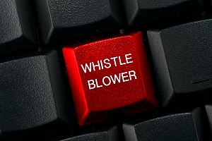 a black keyboard with a red button that says whistle blower on it