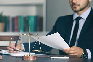 a civil rights attorney reading a report filed for wrongful termination