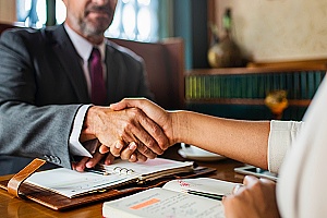 employment law lawyer shaking hands with a client