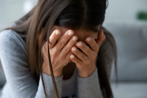 women crying over a wrongful death of a family member