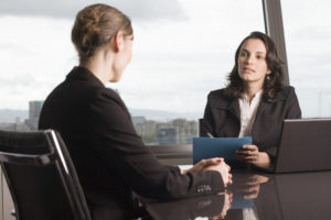 client speaks to her attorney about her options regarding the case of a police office using excessive force