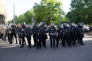 police protect themselves while monitoring protest about police brutality