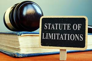 Book, gavel and Statute of limitations sign