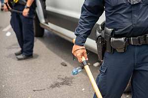 Police holding baton. The statute of limitations may not prevent you from bringing a case