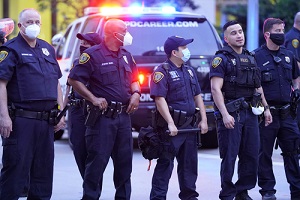 police officers patrolling a street in retaliation