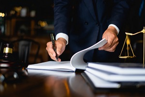 lawyer businessman working or reading lawbook in office