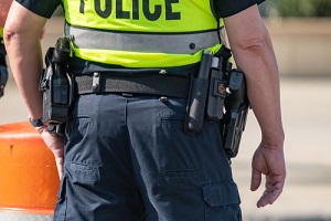 close up of police belt and gun with a shallow depth of field and copy space