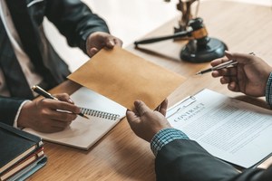 A victim is checking the qualifications of an attorney before hiring him