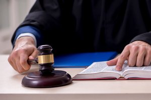 A judge in court reading his judgment