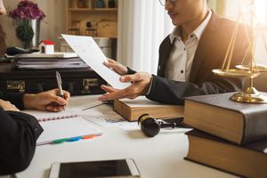 A lawyer reading the bill of rights inside his office