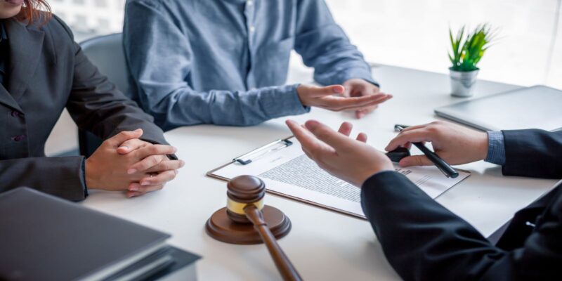 An attorney showing how to file an unlawful detention lawsuit to his clients