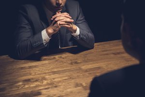 Police interrogation in a dark room